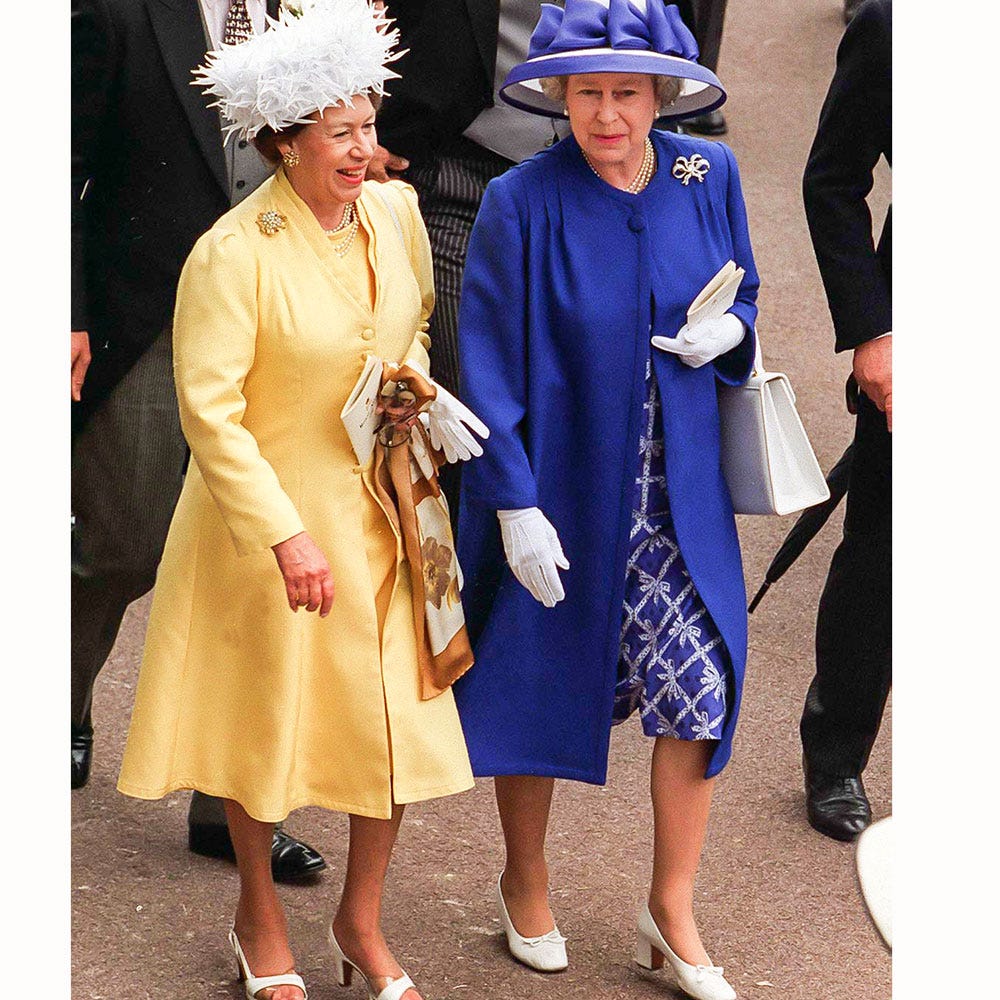 Coat, Outerwear, Hat, Costume design, Costume accessory, Headgear, Dress, Fashion, Electric blue, Blazer, 