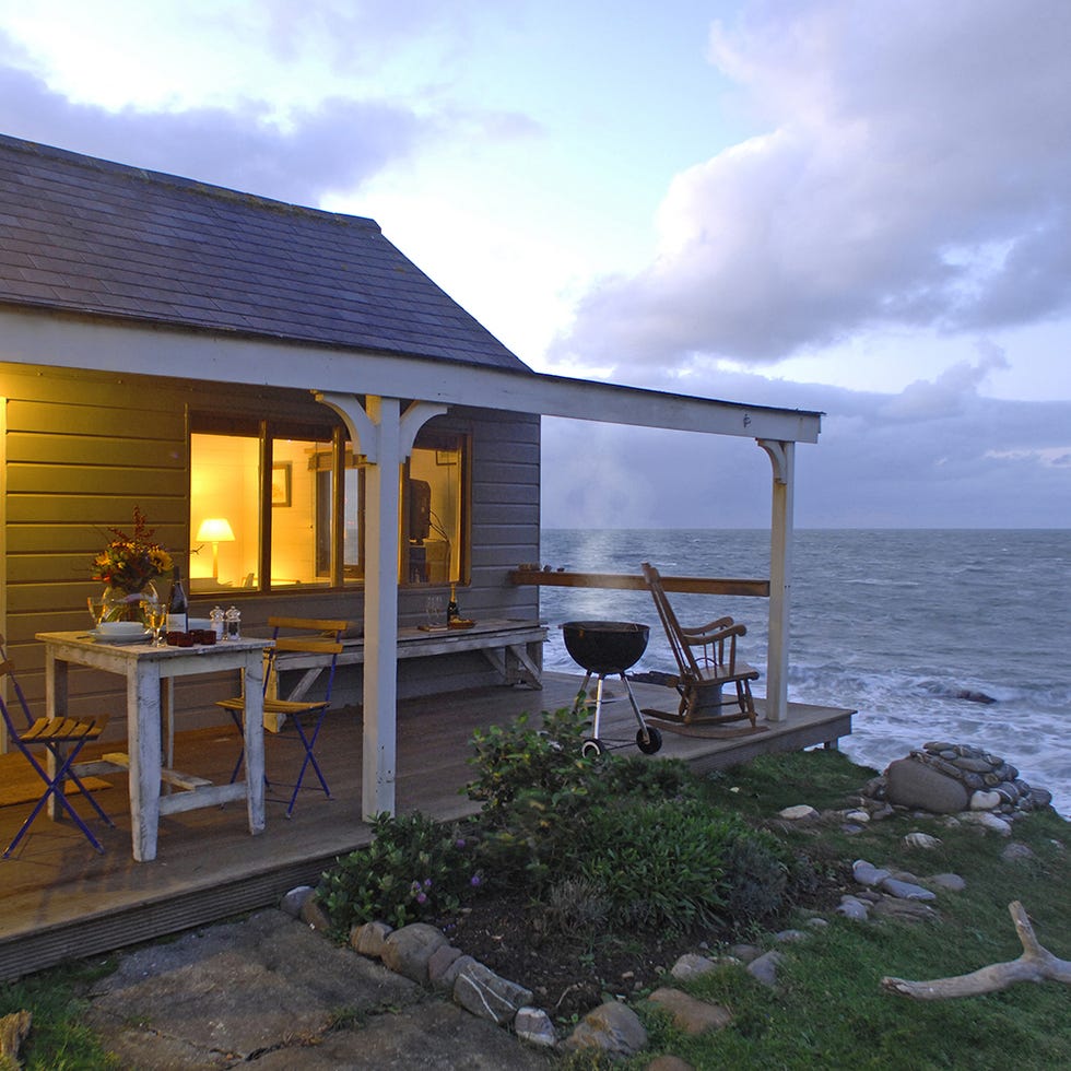 Property, House, Real estate, Table, Furniture, Ocean, Home, Outdoor table, Roof, Outdoor furniture, 