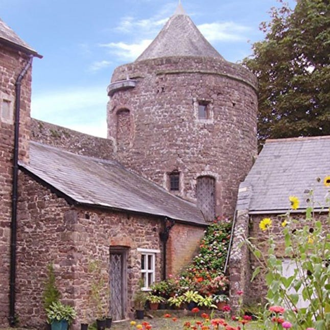 Property, House, Roof, Brick, Flowerpot, Medieval architecture, Garden, Shrub, Turret, Stone wall, 