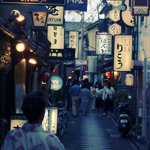 Lighting, Town, Street, Lantern, Human settlement, Snapshot, Pedestrian, Electricity, Market, Electrical supply, 
