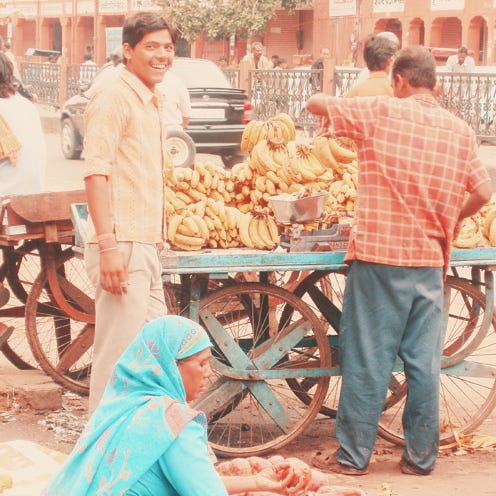 Wheel, Human, Temple, Peddler, Vintage clothing, Spoke, Bicycle wheel rim, Cart, Selling, Hawker, 