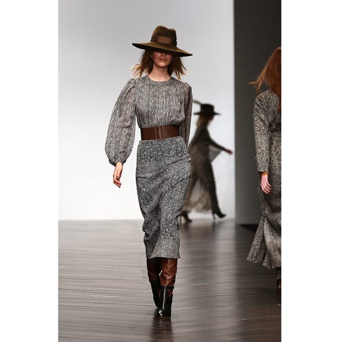 Clothing, Hat, Brown, Human body, Fashion show, Shoulder, Textile, Joint, Outerwear, Waist, 