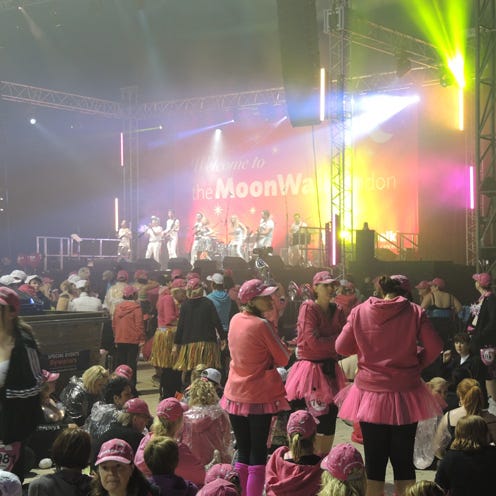 Entertainment, Event, Magenta, Crowd, Pink, Performance, Cap, Music venue, Public event, Audience, 