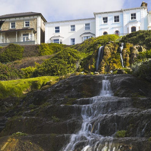 Window, Building, Real estate, House, Residential area, Stream, Waterfall, Home, Water feature, Roof, 