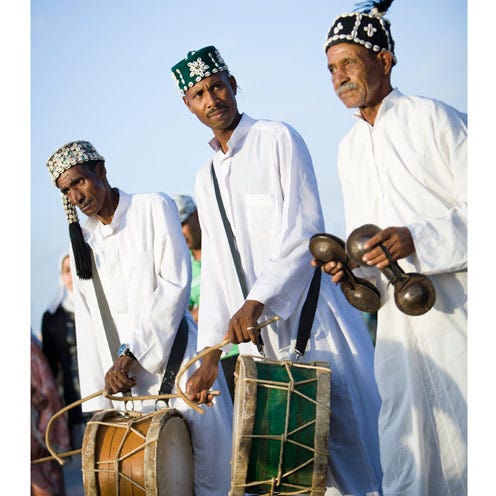 Musical instrument, People, Drum, Membranophone, Music, Musician, Band plays, Headgear, Performance, Music artist, 