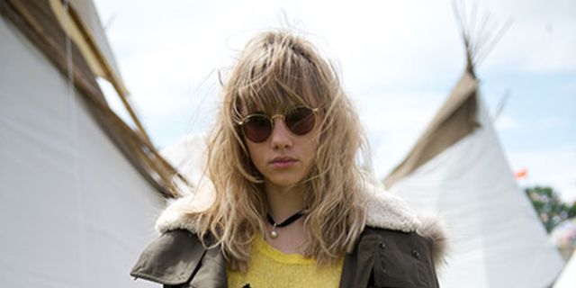 Jacket, Sleeve, Sunglasses, Textile, Outerwear, Street fashion, Tent, Denim, Blond, Goggles, 