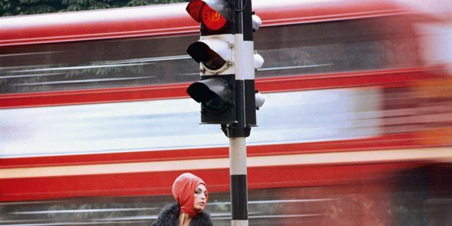 Red, Street fashion, Traffic light, Bag, signaling device, Bus, Public transport, Traffic sign, Public utility, Baggage, 