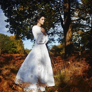 Clothing, Sleeve, Dress, Tree, People in nature, Gown, One-piece garment, Day dress, Spring, Trunk, 