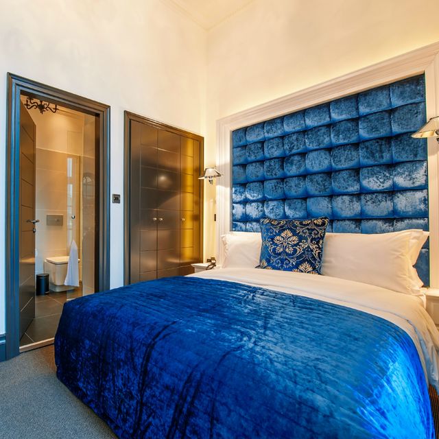 Bed, Blue, Lighting, Interior design, Room, Property, Bedding, Textile, Bedroom, Wall, 
