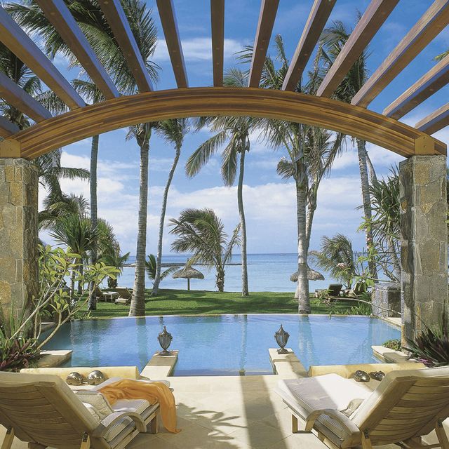 Swimming pool, Resort, Outdoor furniture, Real estate, Sunlounger, Tropics, Seaside resort, Caribbean, Shade, Resort town, 