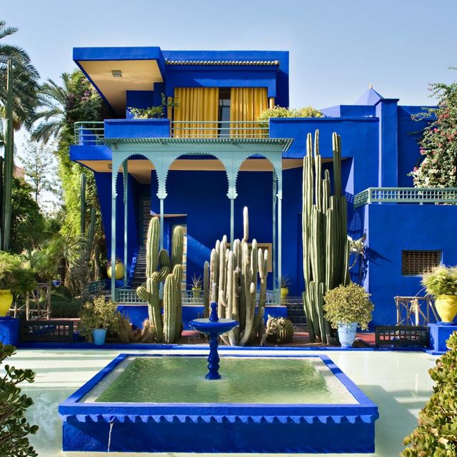 Blue, Majorelle blue, Real estate, Facade, Shrub, Azure, Garden, Water feature, Fountain, Column, 