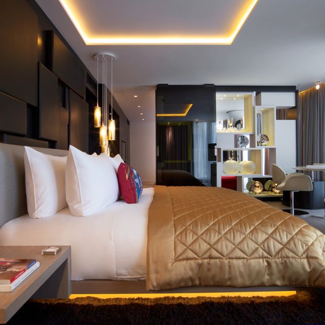 Lighting, Room, Interior design, Yellow, Bed, Property, Floor, Bedding, Wall, Textile, 