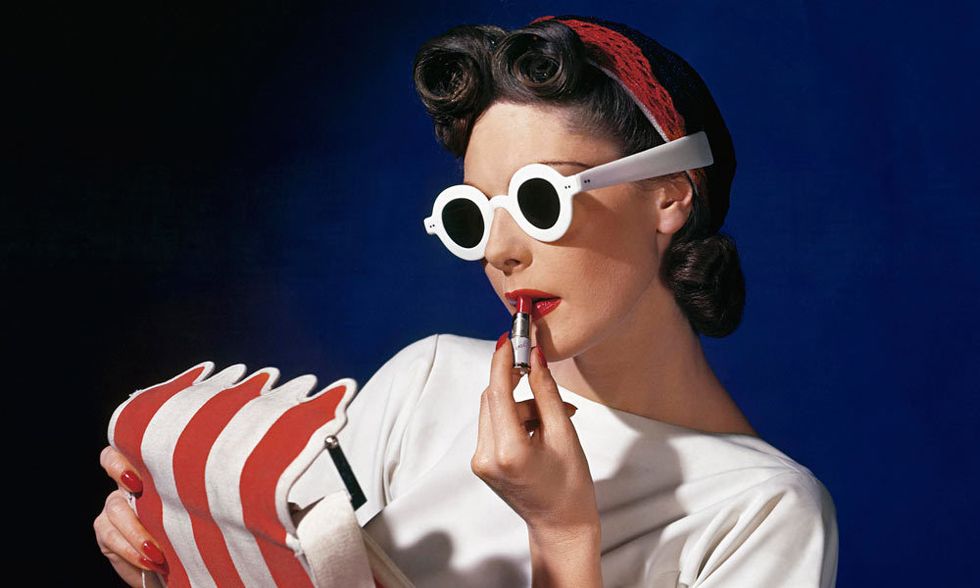 Eyewear, Vision care, Finger, Earrings, Goggles, Sunglasses, Gesture, Flag of the united states, Tobacco products, Hair accessory, 