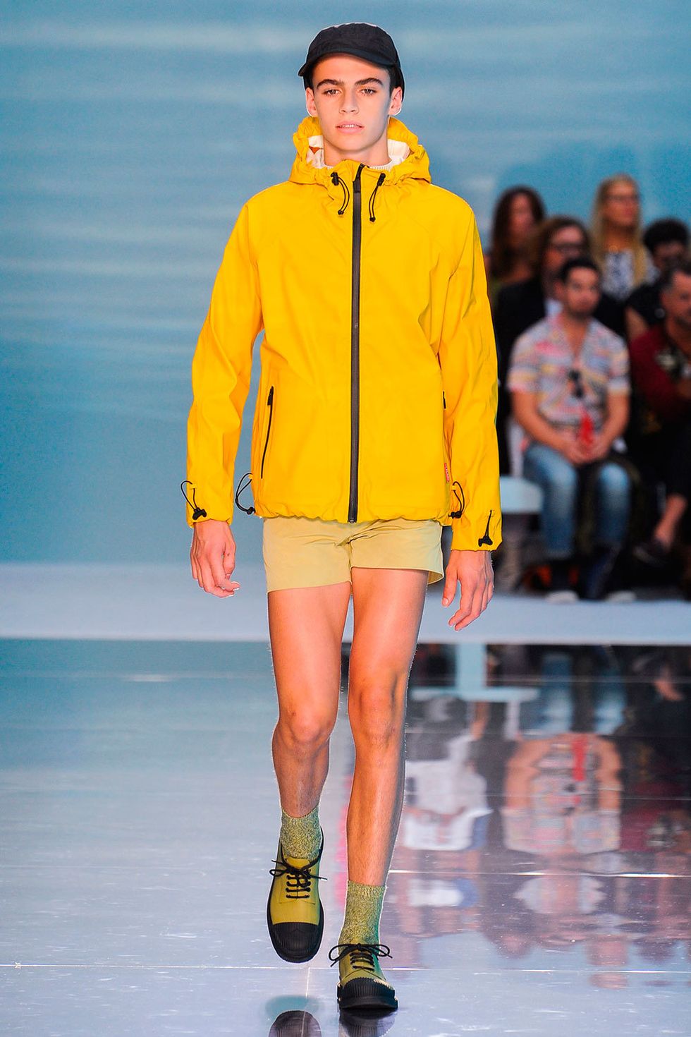 Yellow, Human leg, Shoulder, Jacket, Fashion show, Joint, Outerwear, Runway, Style, Orange, 
