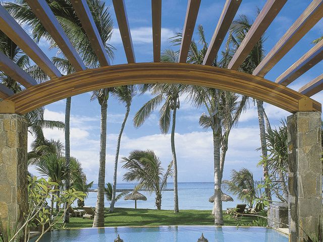 Swimming pool, Resort, Outdoor furniture, Real estate, Sunlounger, Tropics, Seaside resort, Caribbean, Shade, Resort town, 