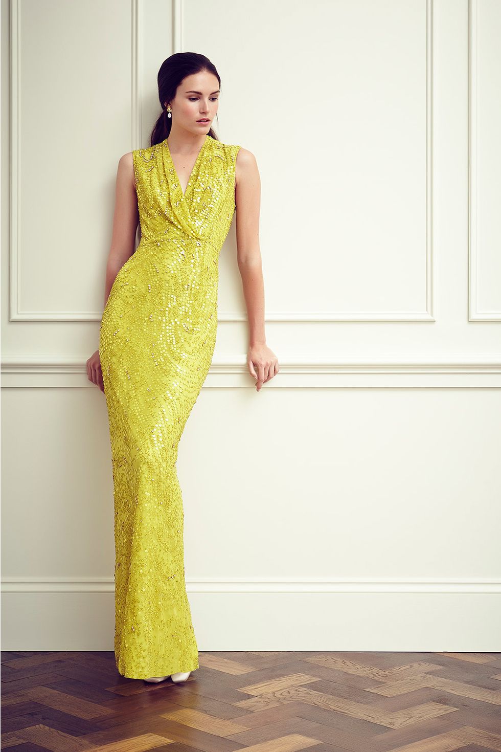 Yellow, Floor, Shoulder, Flooring, Textile, Joint, Standing, One-piece garment, Formal wear, Dress, 