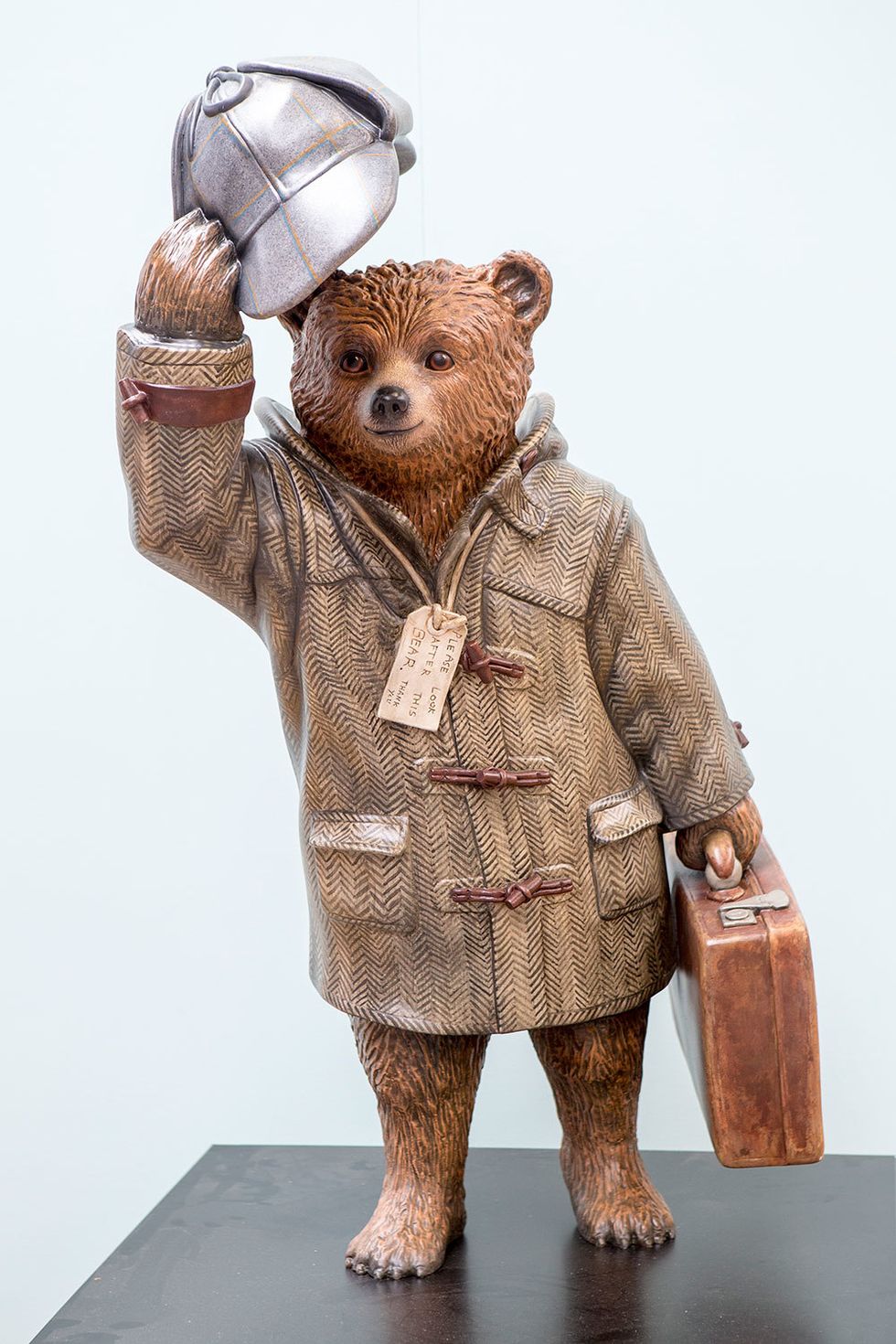 Sculpture, Snout, Art, Teddy bear, Baggage, Figurine, Creative arts, Briefcase, Toy, Animal figure, 
