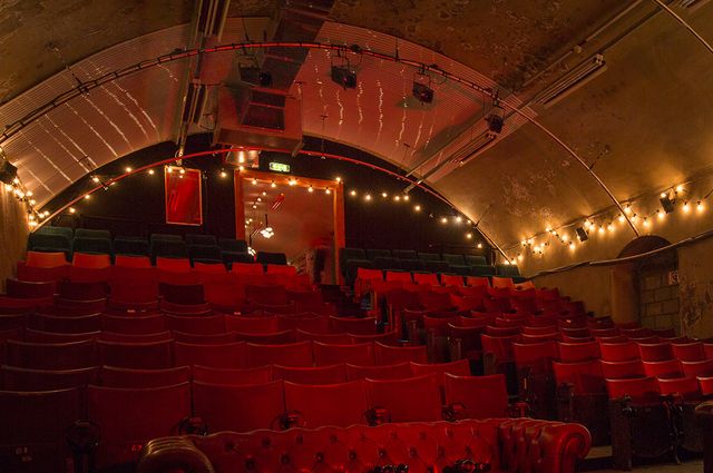 Lighting, Red, Interior design, Amber, Ceiling, Theatre, Electricity, Hall, Light fixture, Maroon, 