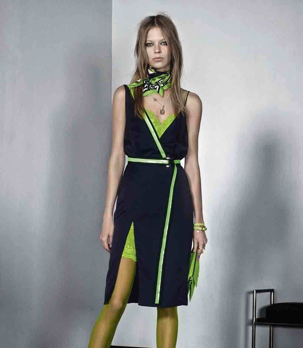 Clothing, Green, Yellow, Dress, Shoulder, Human leg, Joint, Standing, One-piece garment, Style, 