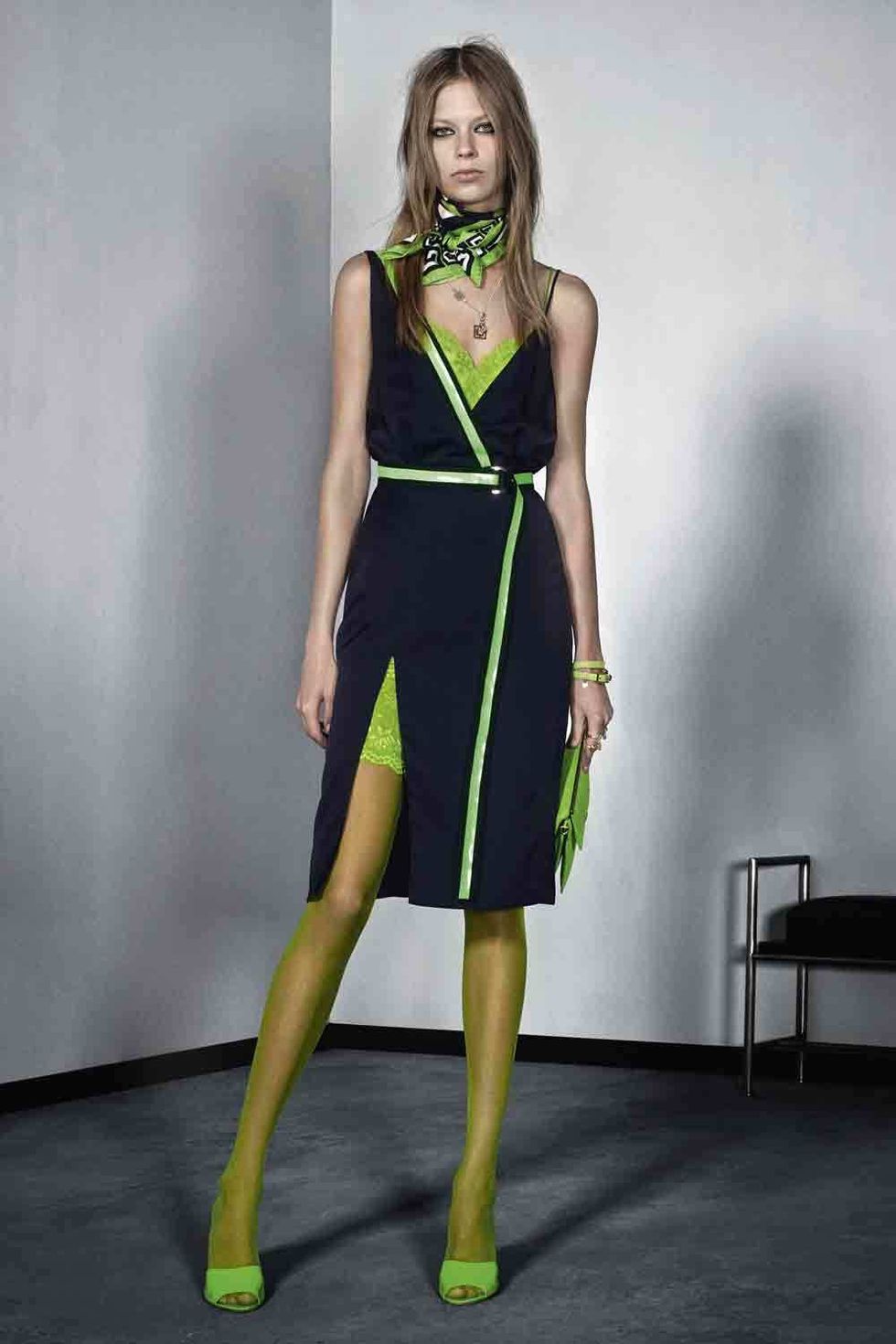 Clothing, Green, Yellow, Dress, Shoulder, Human leg, Joint, Standing, One-piece garment, Style, 
