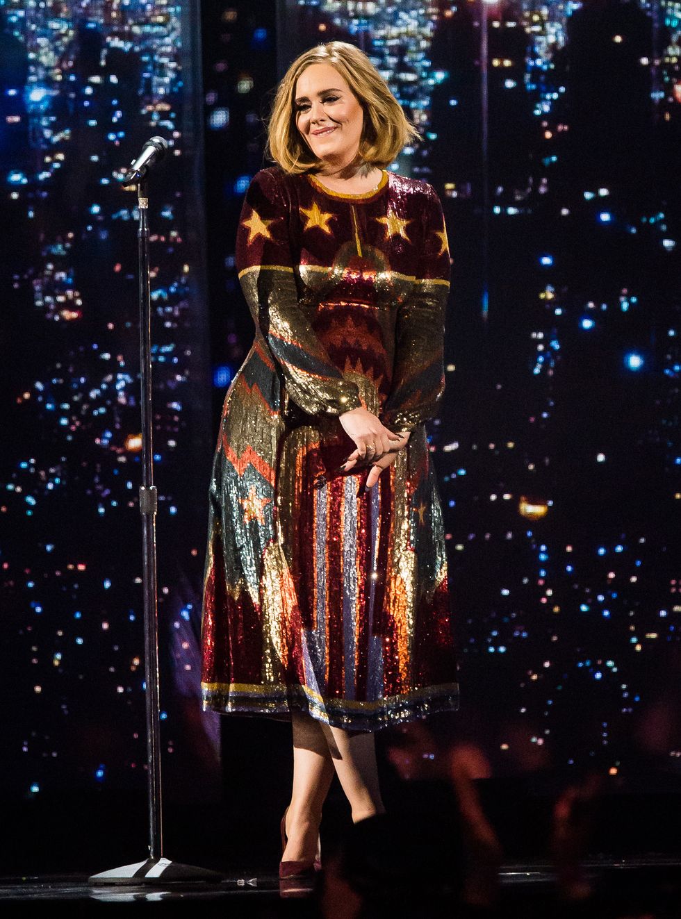 Adele performing on stage - helps a fan propose