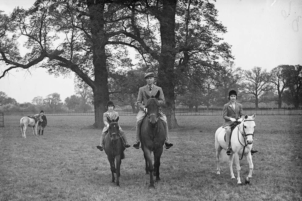 Princess Elizabeth out riding with her sister and father in 1938