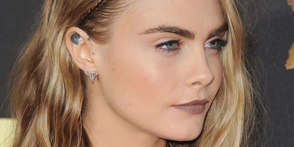 Cara Delevingne with a plaited parting