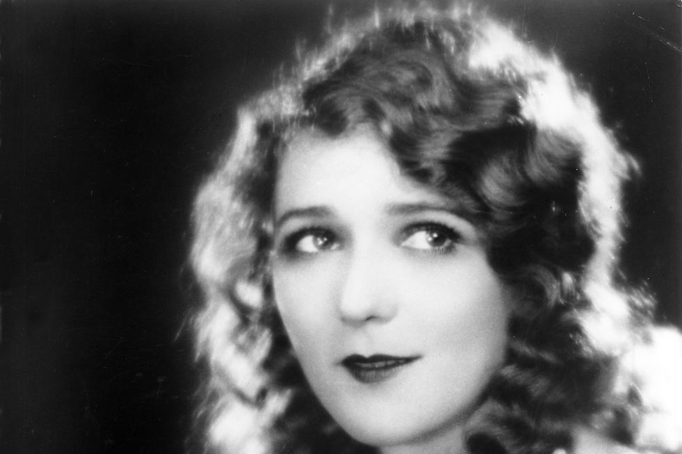 <p>As soft and ethereal as the early films this style was worn for, brushed out waves gave actresses like Mary Pickford a feminine silhouette.</p>