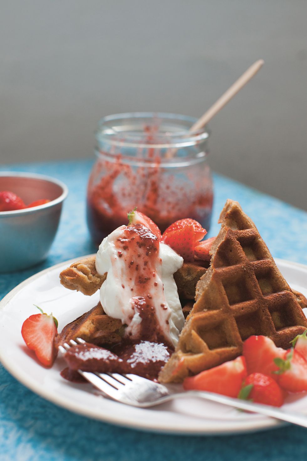 the good life eatery's chestnut and almond waffles with strawberry chia jam