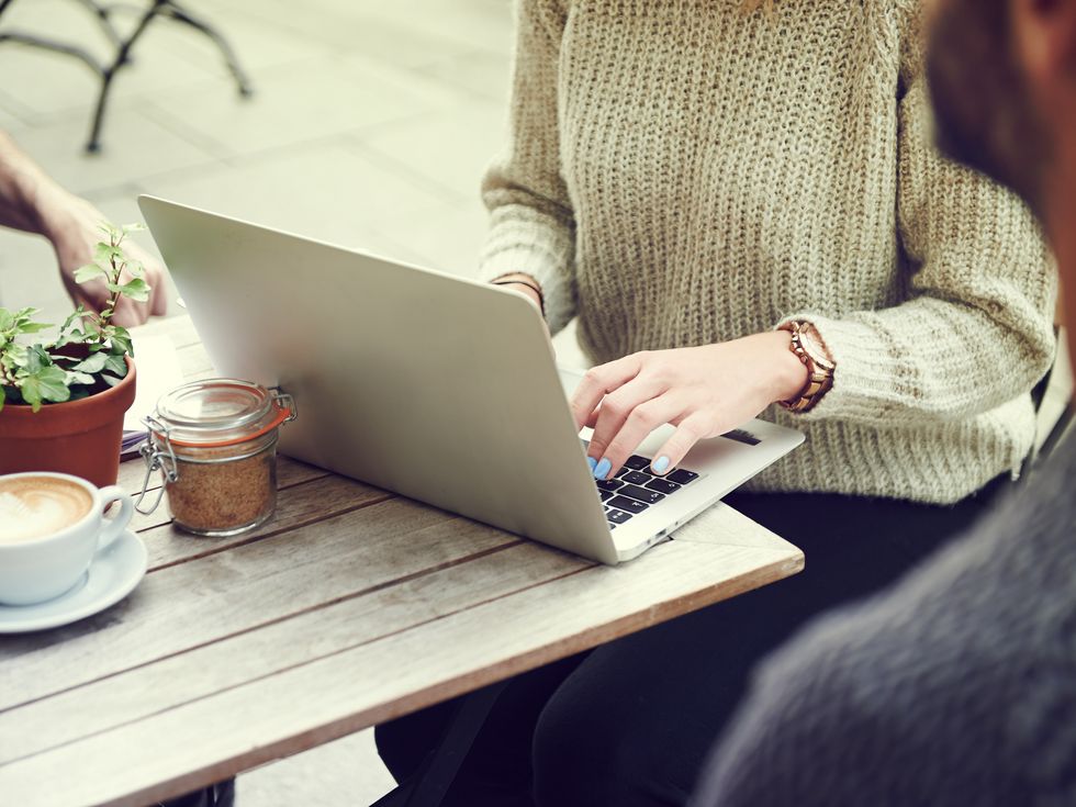 woman typing on a laptop