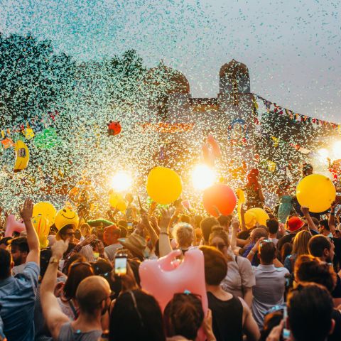 Head, Crowd, People, Yellow, Event, Orange, Party supply, Hat, T-shirt, Celebrating, 