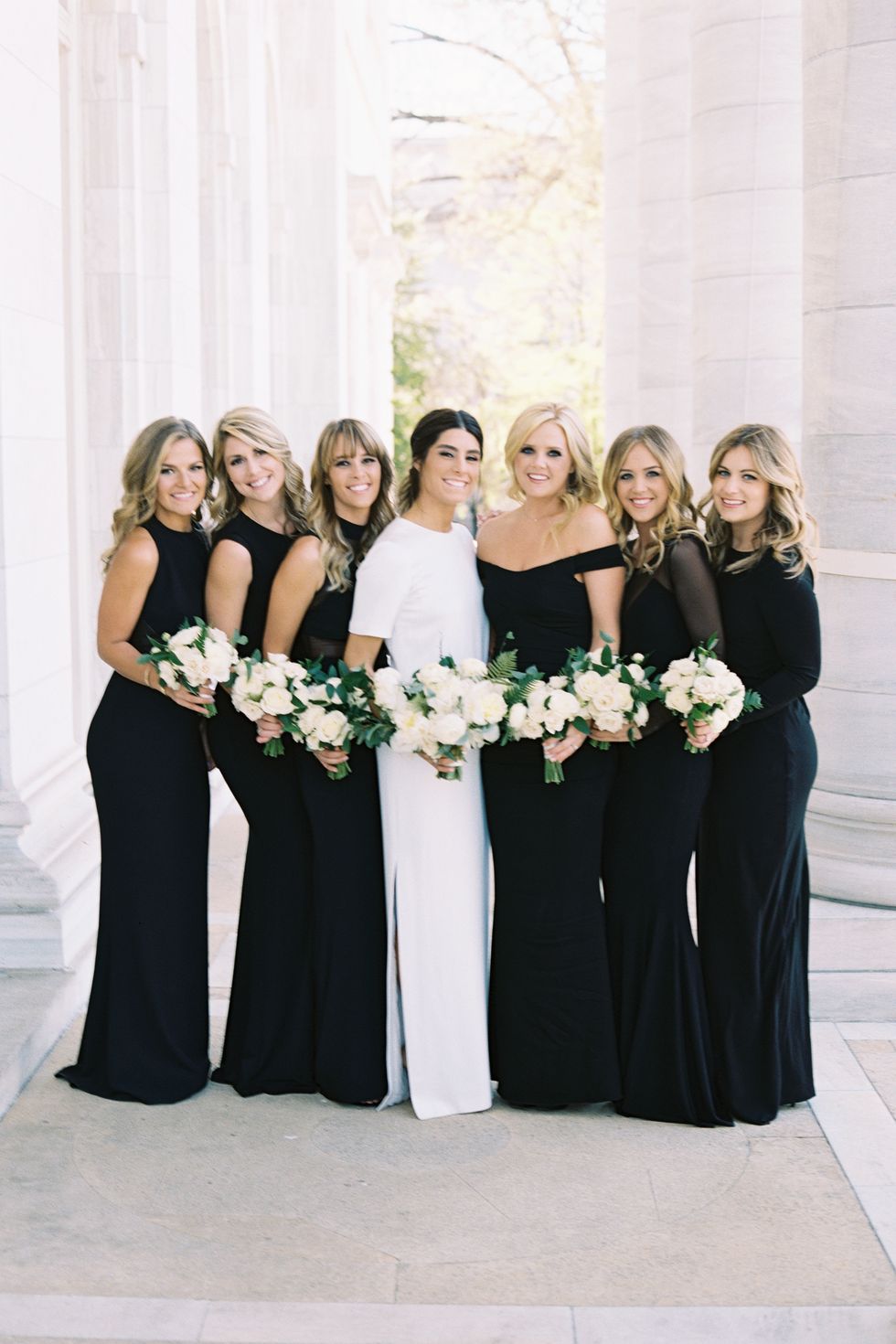 <p>Arielle's six best friends from college served as her bridesmaids, and wore different black dresses from <a href="https://www.aliceandolivia.com/" target="_blank" tabindex="-1">Alice & Olivia</a>, <a href="http://www.normakamali.com/" target="_blank" tabindex="-1">Norma Kamali</a>, <a href="http://www.nicolemiller.com/" target="_blank" tabindex="-1">Nicole Miller</a>, and <a href="http://www.halston.com/" target="_blank" tabindex="-1">Halston Heritage</a>.</p>