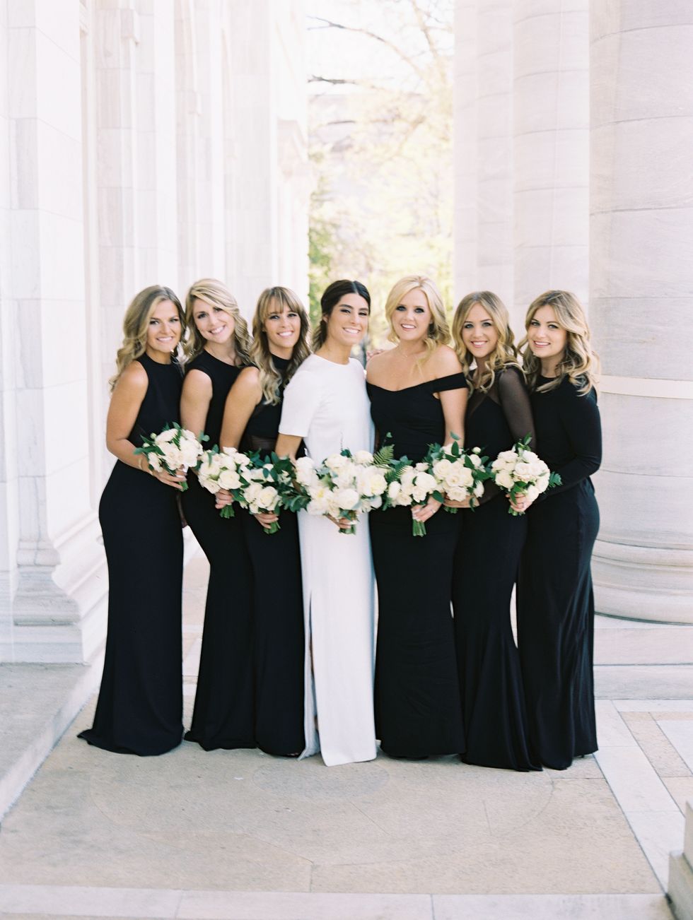 <p>Arielle's six best friends from college served as her bridesmaids, and wore different black dresses from <a href="https://www.aliceandolivia.com/" target="_blank" tabindex="-1">Alice & Olivia</a>, <a href="http://www.normakamali.com/" target="_blank" tabindex="-1">Norma Kamali</a>, <a href="http://www.nicolemiller.com/" target="_blank" tabindex="-1">Nicole Miller</a>, and <a href="http://www.halston.com/" target="_blank" tabindex="-1">Halston Heritage</a>.</p>