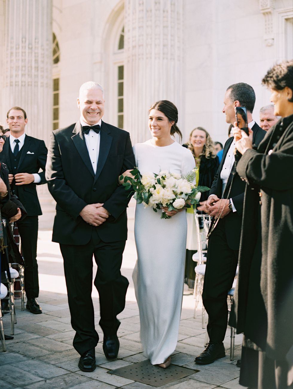 <p>Arielle's father walked her down the aisle as a string quartet played "Samskeyti" by Sigur Rós.</p>