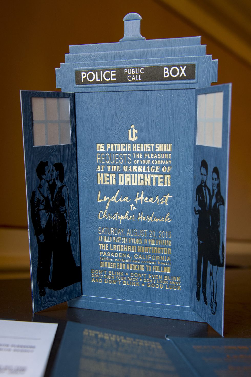 <p>​The unconventional nature to Lydia and Chris' wedding began with the invitation suite, an ode to the Tardis&nbsp;in <em data-redactor-tag="em" data-verified="redactor">Dr. Who</em>. Read the fine print: one of the series best-known&nbsp;quotes is etched into the last line of the invitation. The attire?&nbsp;Cocktail &amp; Cowboy Boots.&nbsp;</p>
