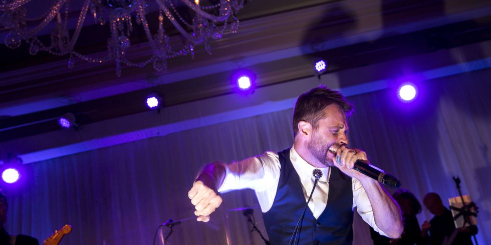 <p>The groom couldn't help but hop on stage for a cameo performance at the reception.​</p>