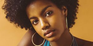 Lip, Hairstyle, Chin, Shoulder, Jewellery, Black hair, Style, Chest, Jheri curl, Fashion accessory, 