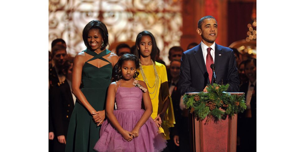 President Barack Obama speaks onstage as Michelle Obama, Sasha Obama and Malia Obama look on during Christmas in Washington 2011 at the National Building Museum on December 11, 2011 in Washington, DC.  21980_004_0349.JPG