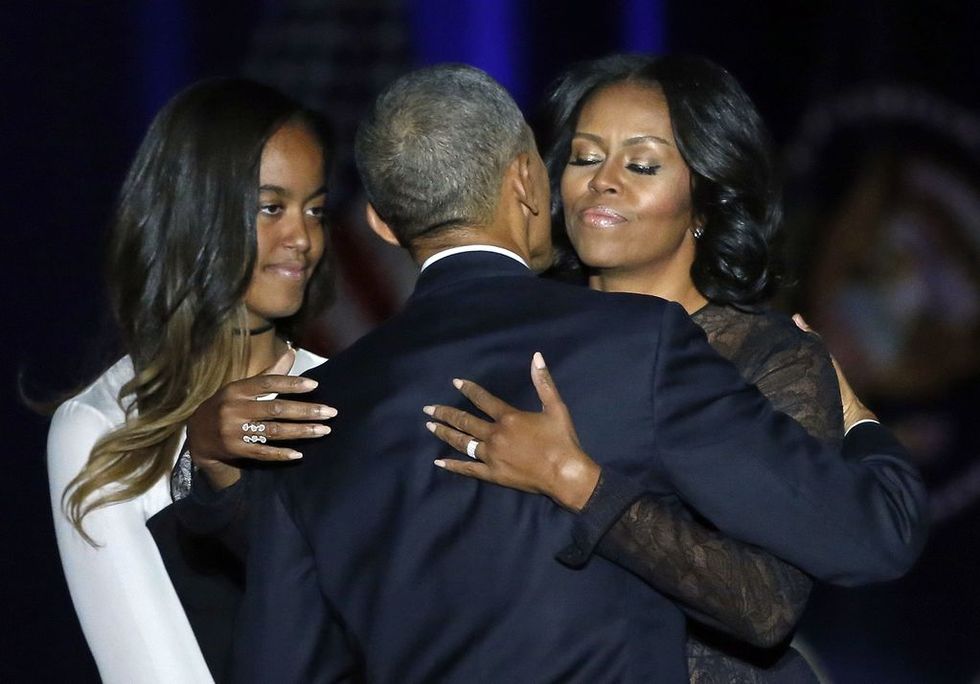 president obama hugs michelle obama at farewell address