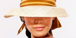 Lip, Hat, Brown, Skin, Chin, Fashion accessory, Headgear, Costume accessory, Tan, Sun hat, 