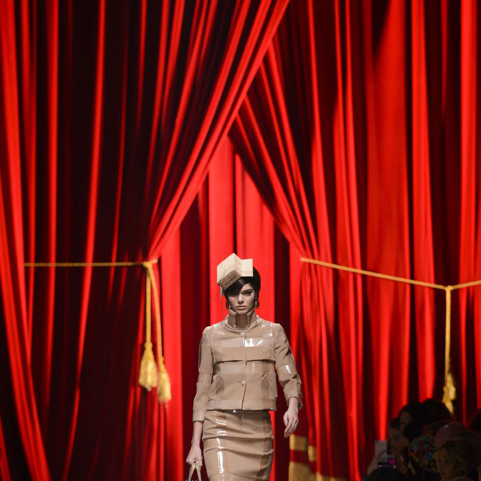 Textile, Red, Fashion show, Runway, Curtain, Theater curtain, Fashion model, Waist, Fashion design, Stage, 