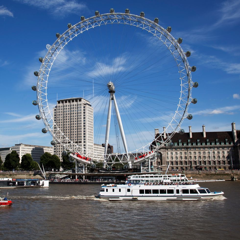 Ferris wheel, Landmark, Sky, Tourist attraction, Architecture, Urban area, Water, River, Wheel, Metropolitan area, 