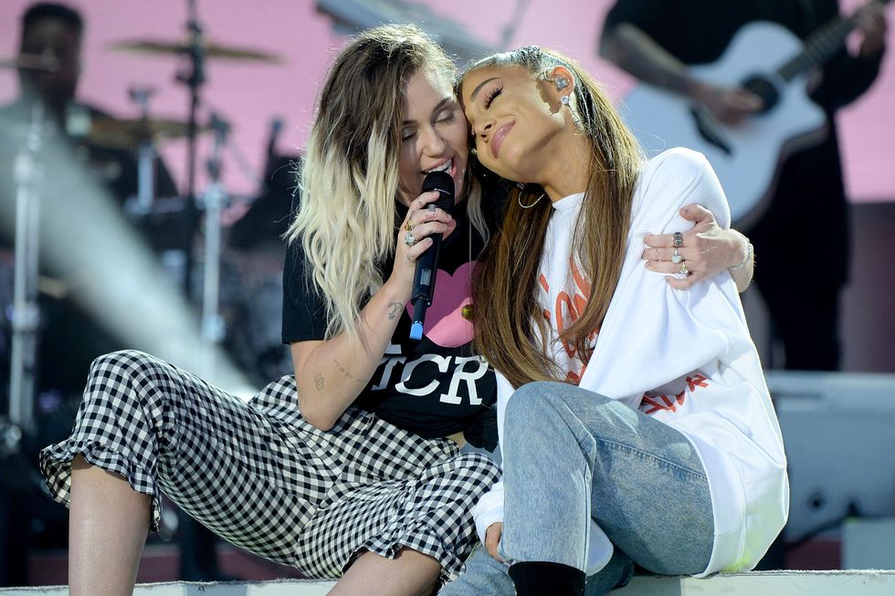 Miley Cyrus and Ariana Grande perform in Manchester