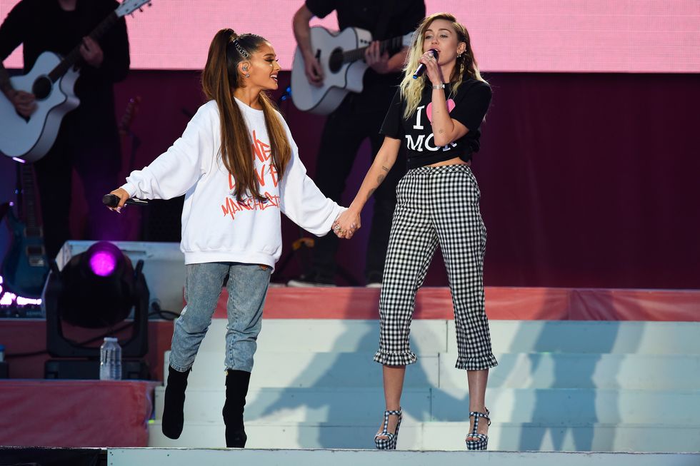 Ariana Grande and Miley Cyrus wearing One Love Manchester merchandise