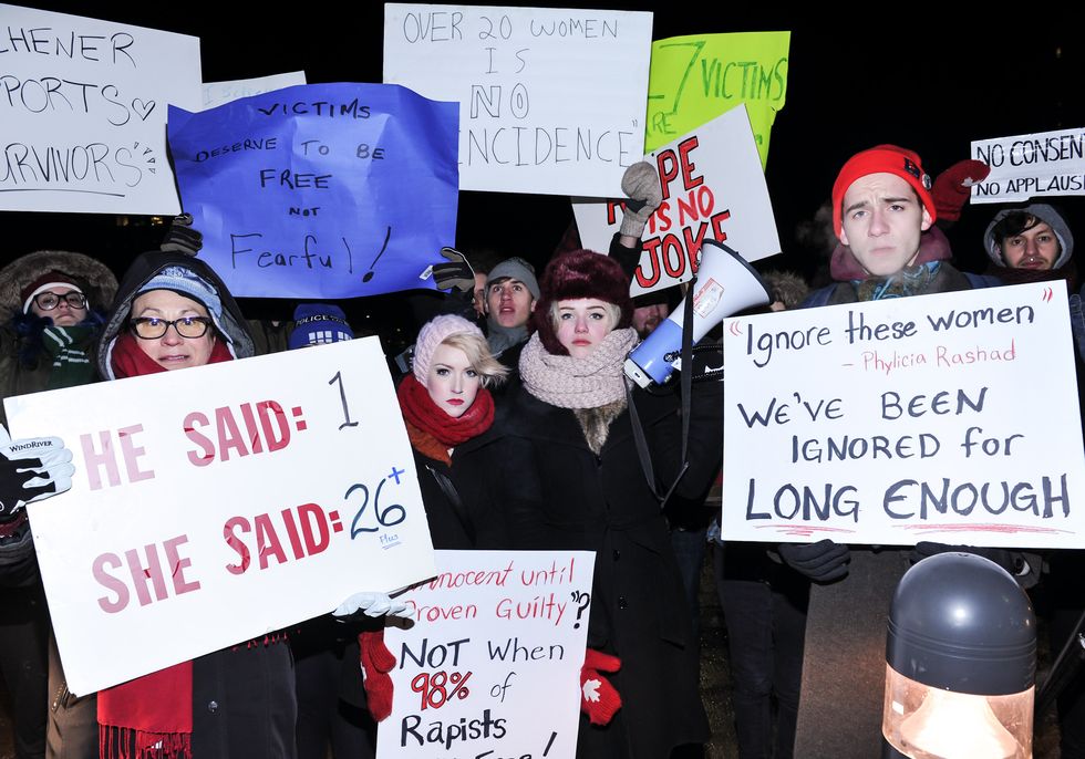 People, Event, Protest, Headgear, Handwriting, Costume accessory, Public event, Poster, Costume, Fur, 