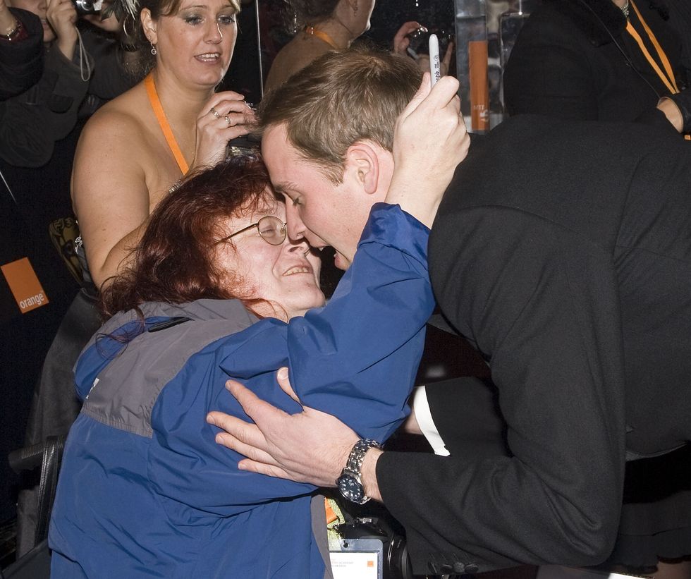 Prince William gets a kiss from a royal fan