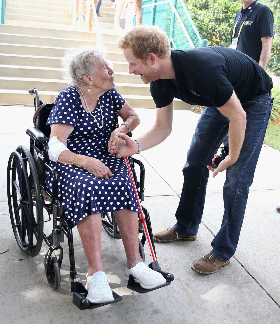 Prince Harry meets 95 year old Ruth Uffleman at the wheelchair tennis on the final day of the Invictus Games Orlando 2016 at ESPN Wide World of Sports on May 12, 2016 in Orlando, Florida. Prince Harry, patron of the Invictus Games Foundation is in Orlando for the Invictus Games 2016. The Invictus Games is the only International sporting event for wounded, injured and sick servicemen and women. Started in 2014 by Prince Harry the Invictus Games uses the power of Sport to inspire recovery and support rehabilitation. (Photo by Chris Jackson -Pool/Getty Images for Invictus)