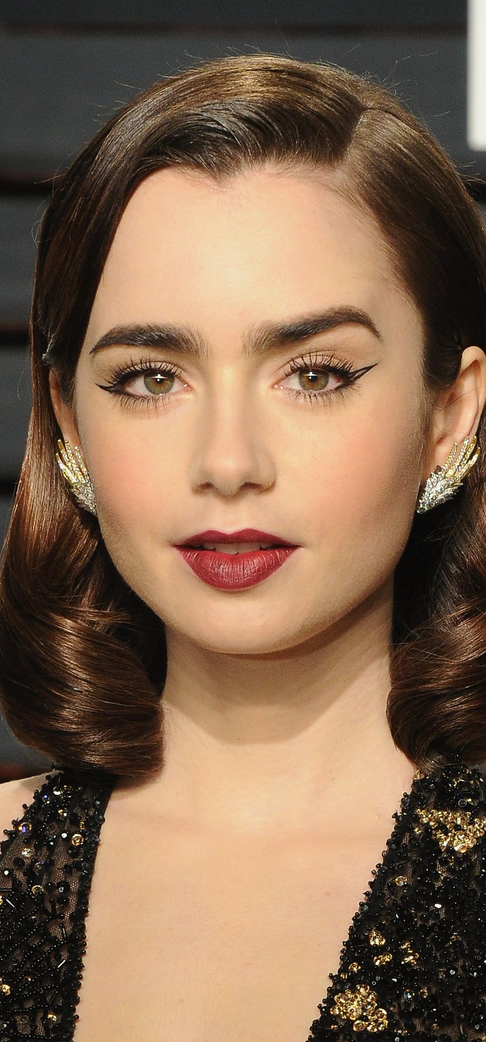 <p>We begin with Miss Lily Collins, who is doing those glassy waves pretty much true to form. (Why are they still such a crowdpleaser? Easy—because Old Hollywood glamour never dies, and it goes so well with so many kinds of dresses, it is basically the Nudist sandal of hair.) So yes, this means that you could still do exactly the same hair now, and it would be modern by virtue of you being a 21st-century woman. However...</p>
