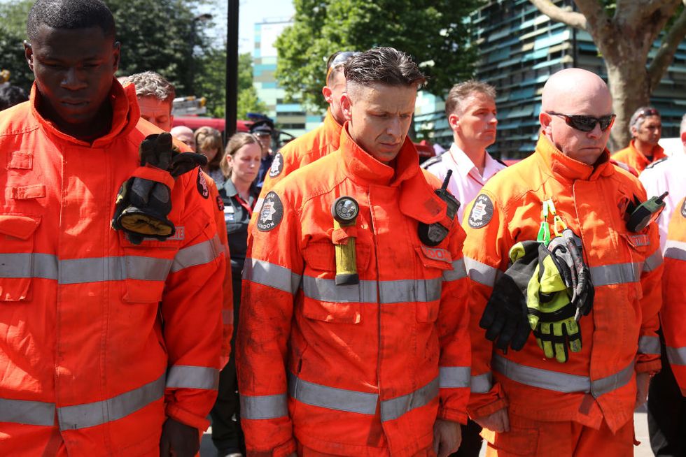 Firefighters hold minute's silence at Grenfell Tower