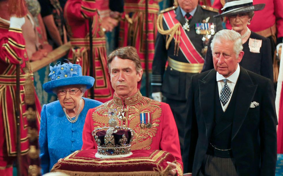 The Queen, Prince Charles and the crown entering the state opening of parliament